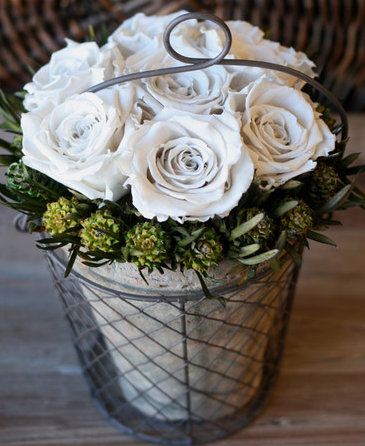 preserved rose arrangement in basket