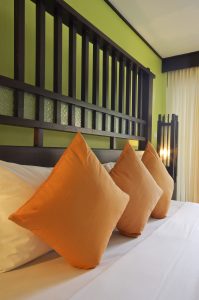 greenery paint with orange pillows