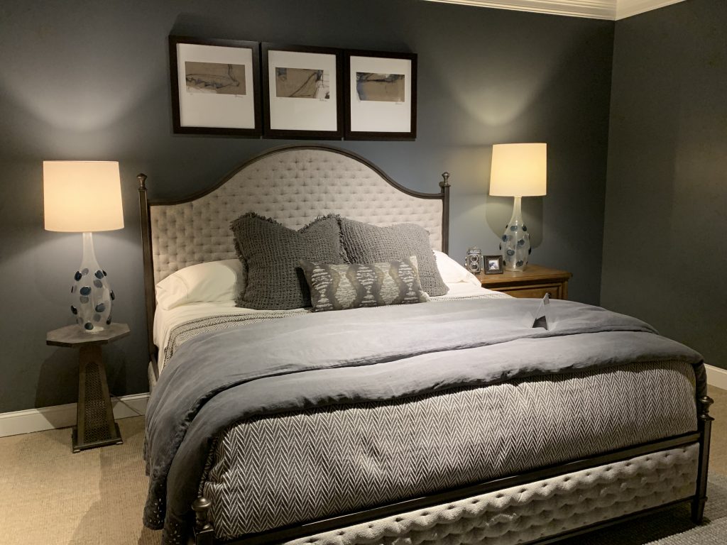 Grey bedroom layout with white headboard